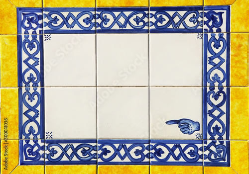 plaque of yellow and blue portuguese tiles