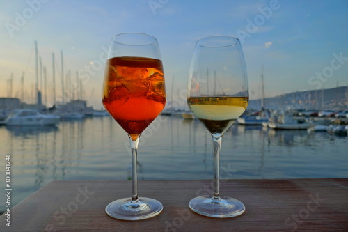 Waiting for the sunset while enjoying an aperitif.  A pleasant evening in Italy    © anela47