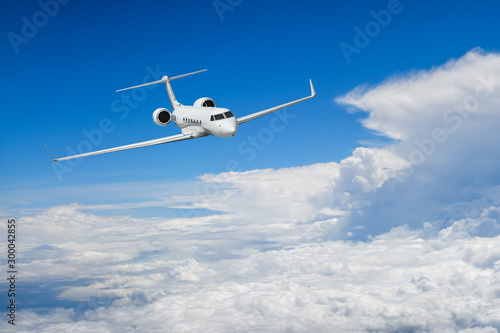 White airplane flying above cloud