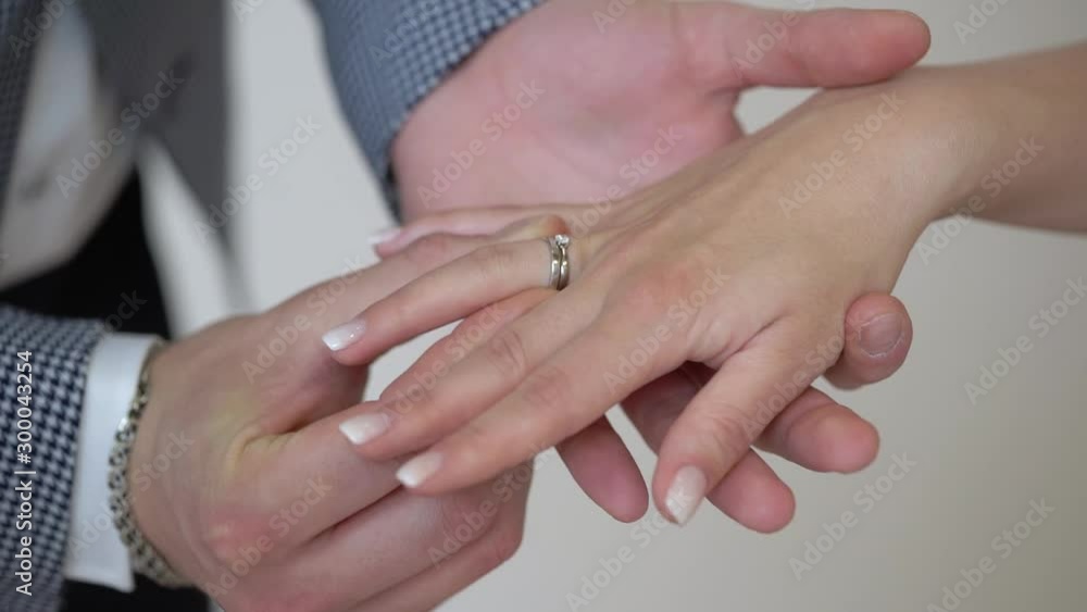 Bride and groom exchange wedding rings at ceremony. Lovely couple. Bride and groom exchange wedding rings at ceremony. Lovely couple.