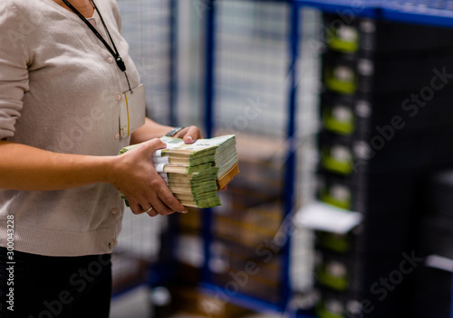 Office worker holding large sum of euro € banknotes