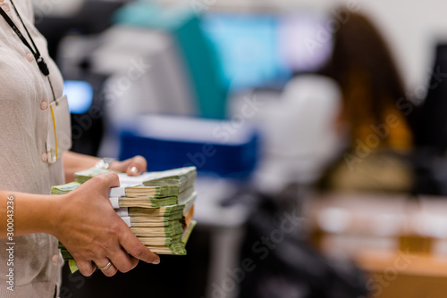 Office worker holding large sum of euro € banknotes