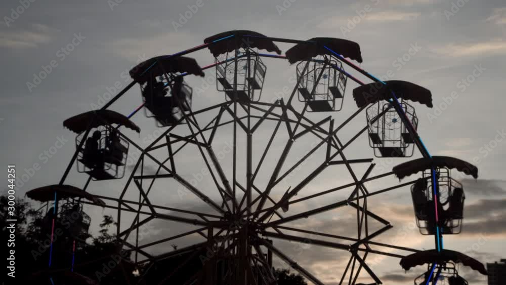 Ferris wheel rotate in evening before sunset in city concept, time lapse, Ferris wheel rotate in evening before sunset in city concept, time lapse,