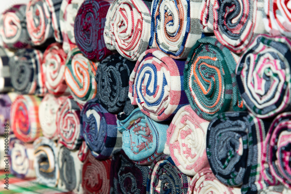 Pile of Loincloth fabric Thailand silk. Thai loincloth roll for sale at the market in thailand Pile of Loincloth fabric Thailand silk. Thai loincloth roll for sale at the market in thailand
