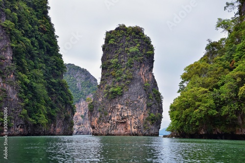 Island, Ocean views near Phuket Thailand with Blues, Turquoise and Greens oceans, mountains, boats, caves, trees resort island of phuket Thailand. Including Phi Phi, Ko Rang Yai, Ko Li Pe and other is