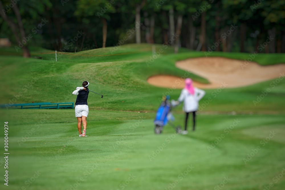 young man playing golf