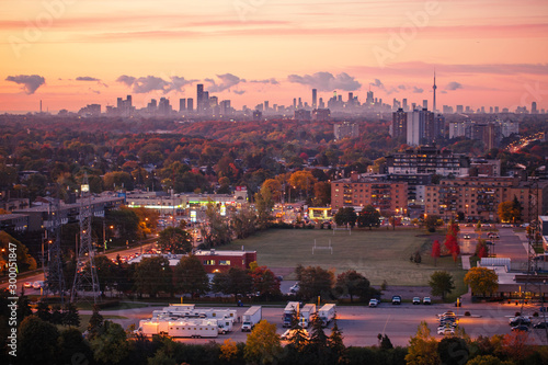 Canvas Print Beautiful pink yellow red purple morning sky clouds in Toronto city, Canada
