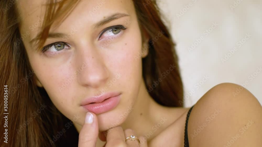 Face of young sexy woman looking towards camera. Face of young sexy woman looking towards camera.