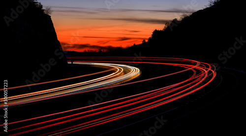 tail light streaks on highway at night. Long exposure.