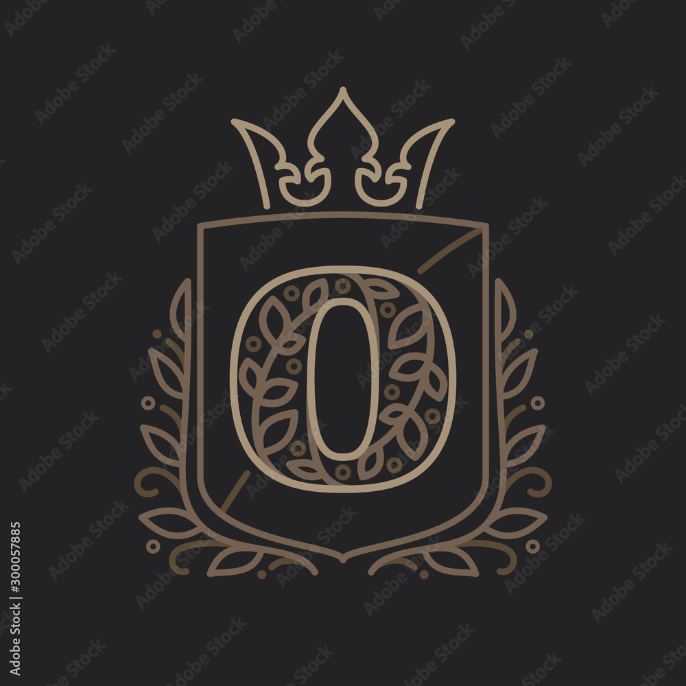 Obraz premium O letter logo consisting of floral pattern letters in a heraldic shield with crown.