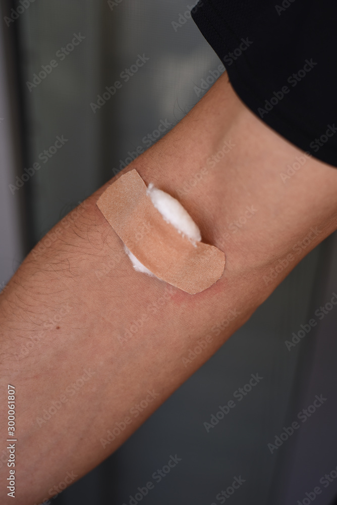 custom made wallpaper toronto digitalMale arm with band aid and cotton on blood draw site