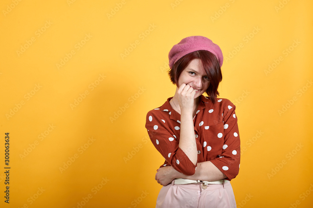Caucasian young attractive lady wearing red shirt with white polka dot over isolated background looking stressed and nervous with hands on mouth biting nails. Anxiety problem. Caucasian young attractive lady wearing red shirt with white polka dot over isolated background looking stressed and nervous with hands on mouth biting nails. Anxiety problem.