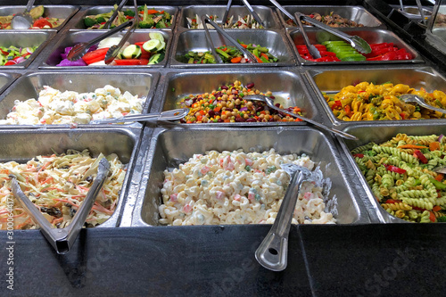 Εκτύπωση καμβά Deli food trays stacked and steaming with a variety of healthy foods for lunch and dinner menu