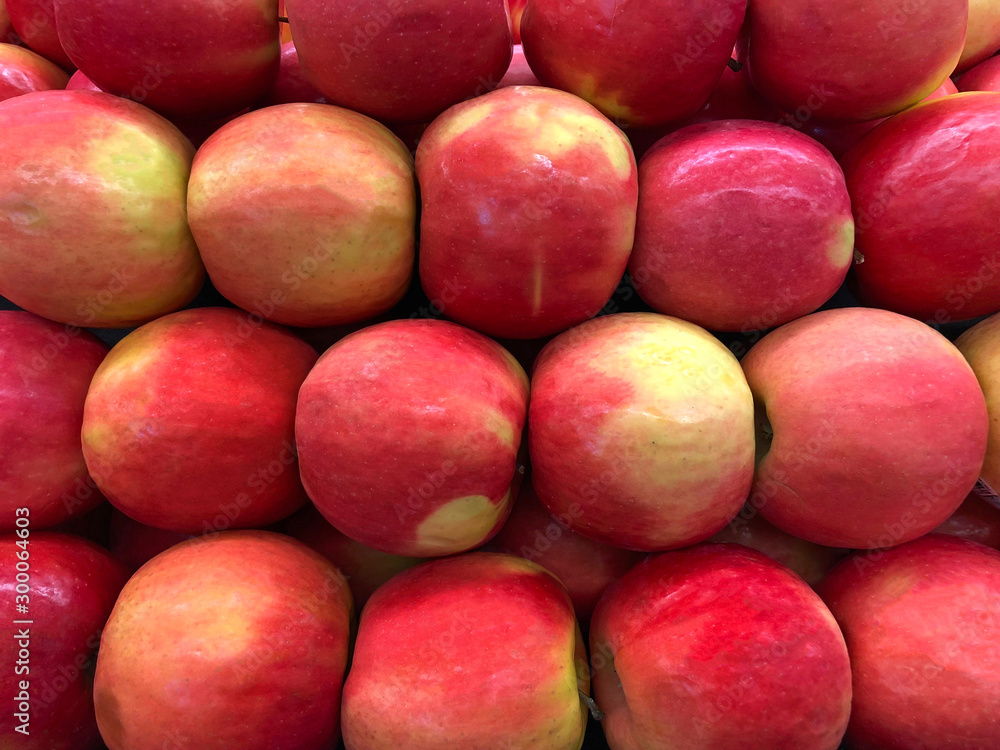 Close up on Cripps large pink apples, a particularly attractive variety of a medium to large size. The flesh is firm, crisp, effervescent, and yellow-white, with a tangy and sweet flavor. Close up on Cripps large pink apples, a particularly attractive variety of a medium to large size. The flesh is firm, crisp, effervescent, and yellow-white, with a tangy and sweet flavor.