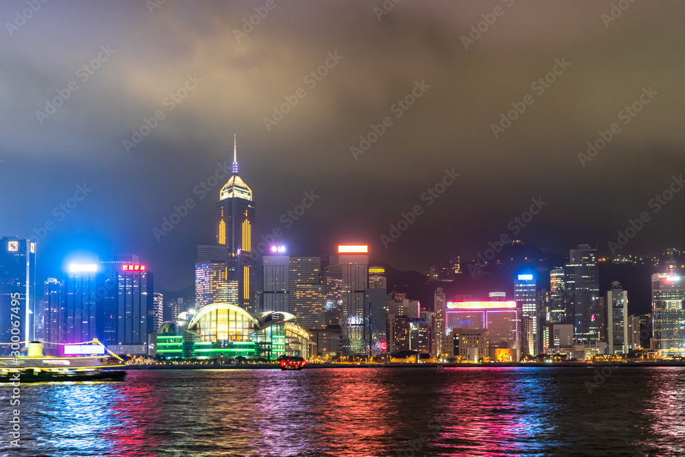August 10,2019 in Hong Kong, Scenic of night cityscape light show and water reflection and cloudy in the sky background ,blurred of fog and clouds dark August 10,2019 in Hong Kong, Scenic of night cityscape light show and water reflection and cloudy in the sky background ,blurred of fog and clouds dark