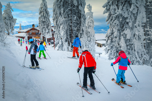 Fotografie Popular ski resort with skiers on the slope, Poiana Brasov