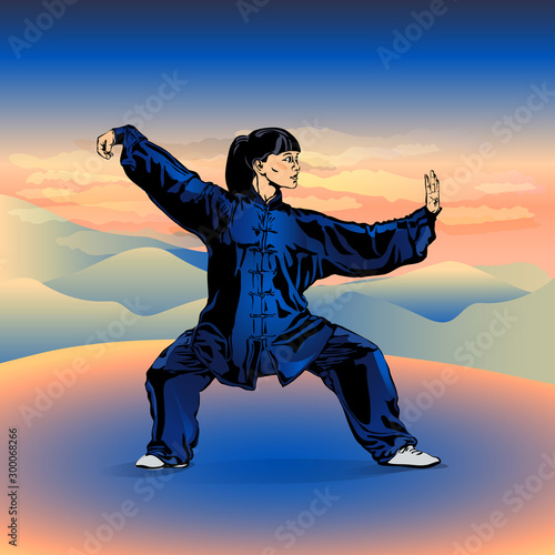 A girl in a kimono costume practices Wushu in the open air among the mountains.