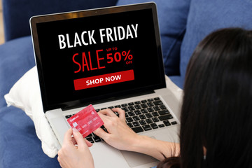Woman hands holding credit card and using laptop computer for shopping black friday online sale, e commerce, discount online shopping, online payment, digital banking, business finance and technology