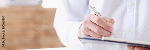 Male medicine doctor hand holding silver photo