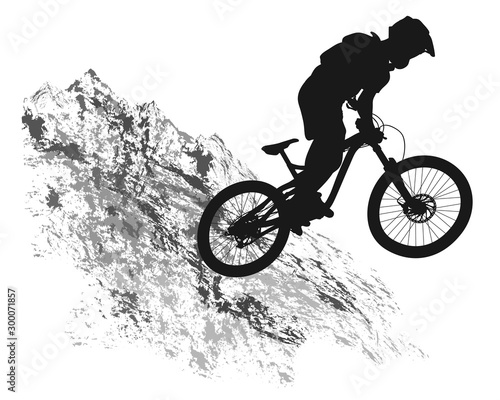 Silhouette of a cyclist on a mountain background.