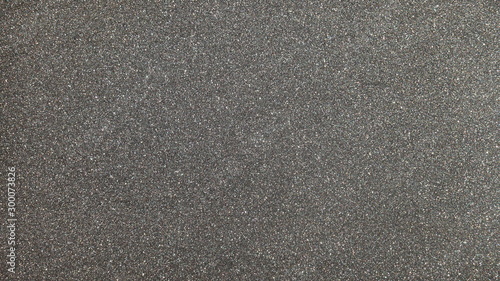 Black gray glitter background texture. Element of design.