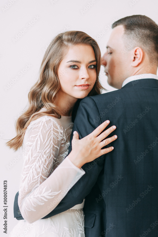 Stylish ceremony in European style. Beautiful couple in the interior Studio. Stylish ceremony in European style. Beautiful couple in the interior Studio.