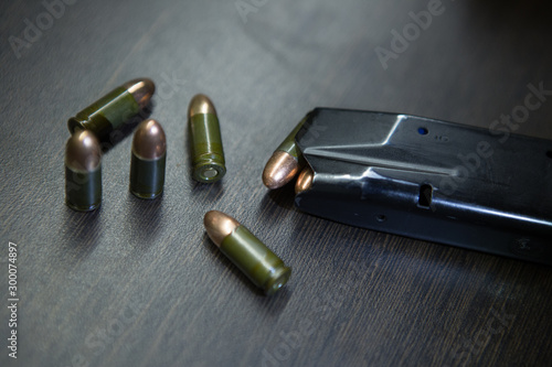 pistol cartridges 9 mm closeup okoto pistol, dark background