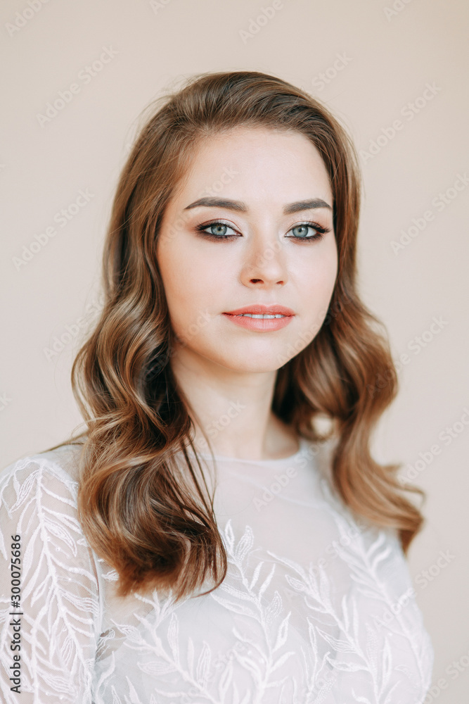 Wedding dress in the interior Studio. Portrait of the bride on a white background. Wedding dress in the interior Studio. Portrait of the bride on a white background.