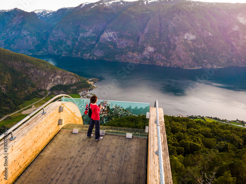 Tourist enjoying fjord view on Stegastein viewpoint Norway © Voyagerix