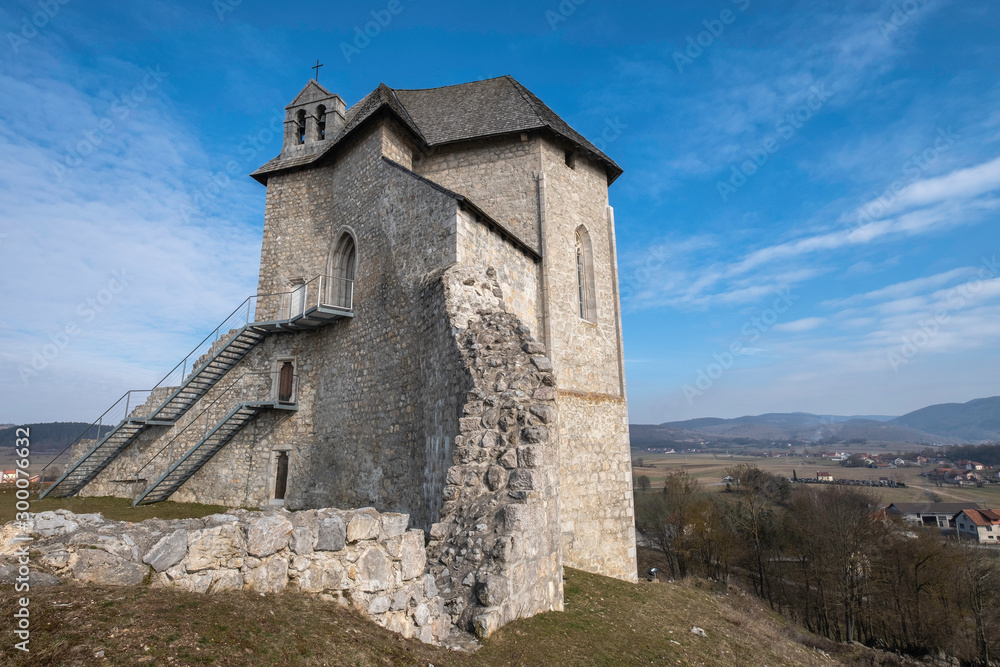 Ruins of the castle Sokolac with the chapel of Holy trinity on the hill in village Brinje, Lika, Croatia
