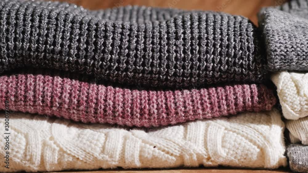 Neatly folded warm winter clothes Neatly folded warm winter clothes