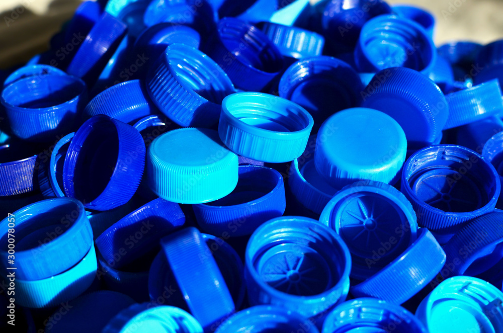 Plastic bottle caps background. Cap material is recyclable.Remove lids