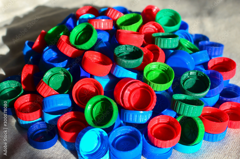 Plastic bottle caps background. Cap material is recyclable.Remove lids