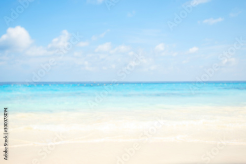 Blur summer white sand beach with sparkling sea water © яна винникова