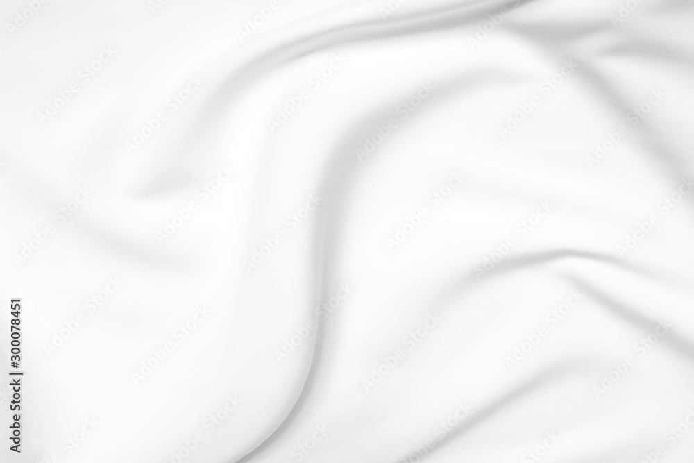 Abstract white fabric texture background. Cloth soft wave. Creases of satin, silk, and cotton.