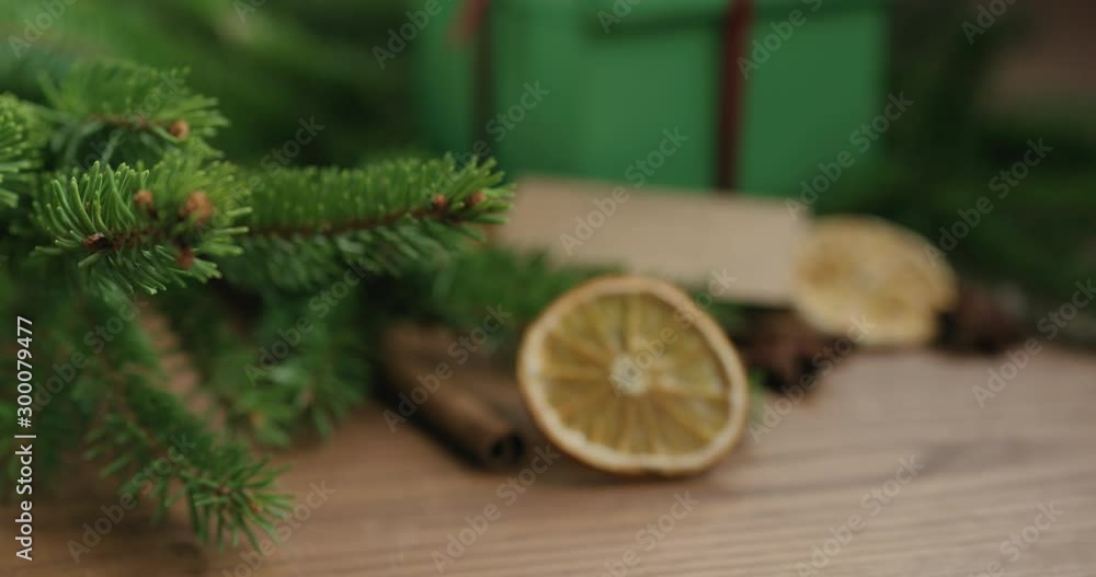 Closeup forward slide shot reveal green gift box with merry christmas card Closeup forward slide shot reveal green gift box with merry christmas card