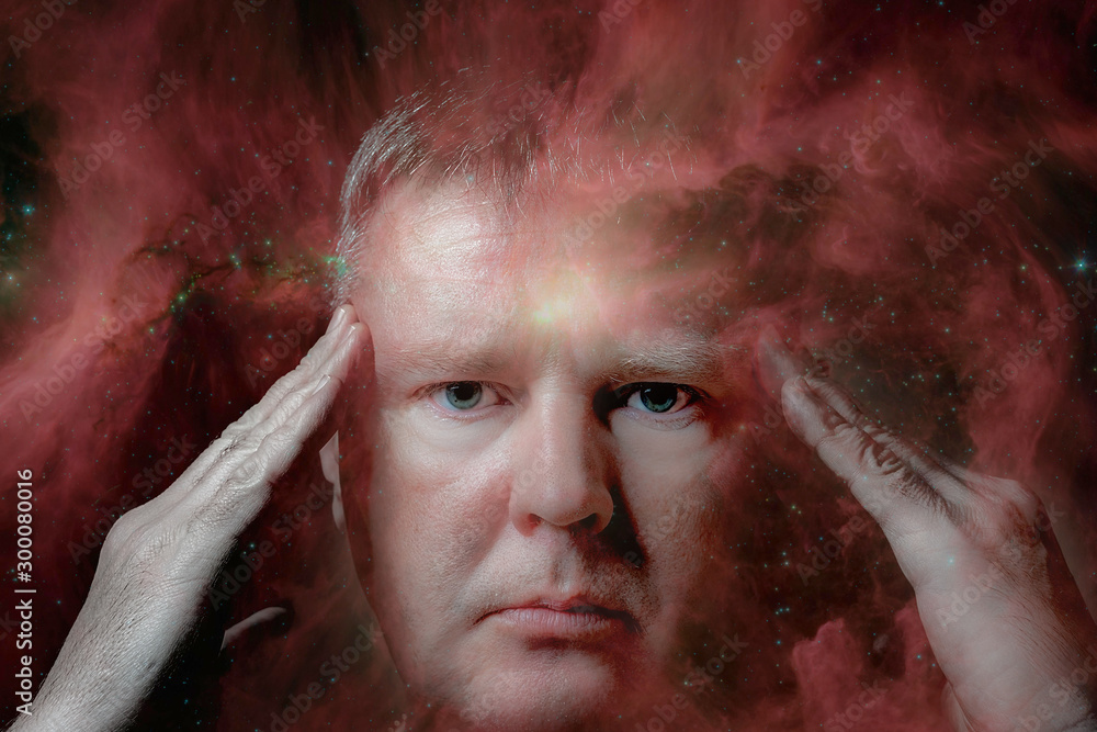 Obraz premium Clairvoyance, foresight, extrasensory perception, and paranormal abilities. Portrait of a man with bright yellow eyes. Elements of this image furnished by NASA