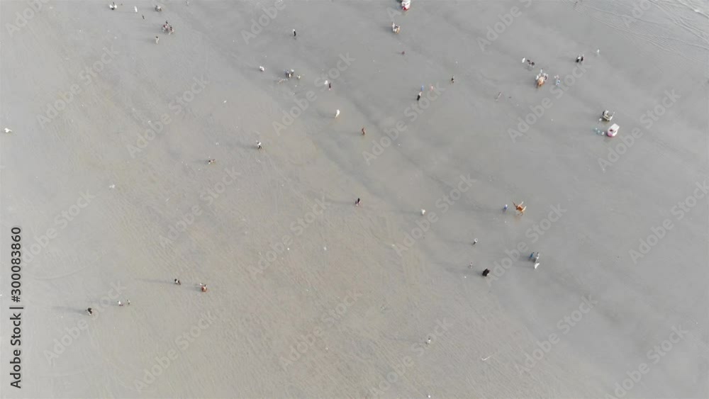 Sea View - Top Aerial View Of Visitors Playing On The Beach And Beautiful Waves - Moving Down Sea View - Top Aerial View Of Visitors Playing On The Beach And Beautiful Waves - Moving Down