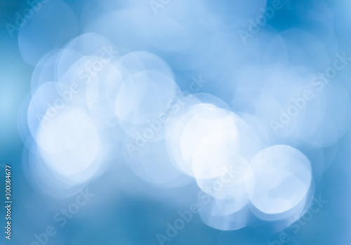 Abstract blurred blue background for Christmas or winter concept. Festive blu...