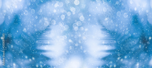 Abstract blurred blue background for Christmas or winter concept. Silhouette ...