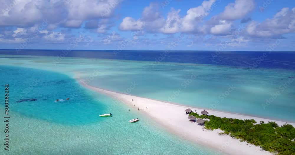 small tropical island with palm forest and white beach, Caribbean sea with turquoise water coral reef. surrounded by boats small tropical island with palm forest and white beach, Caribbean sea with turquoise water coral reef. surrounded by boats