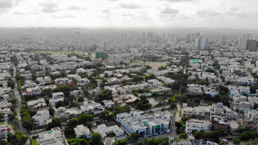 Hill Park - Top Aerial View Of Cities With White Housing And Skyscraper - Moving Down 