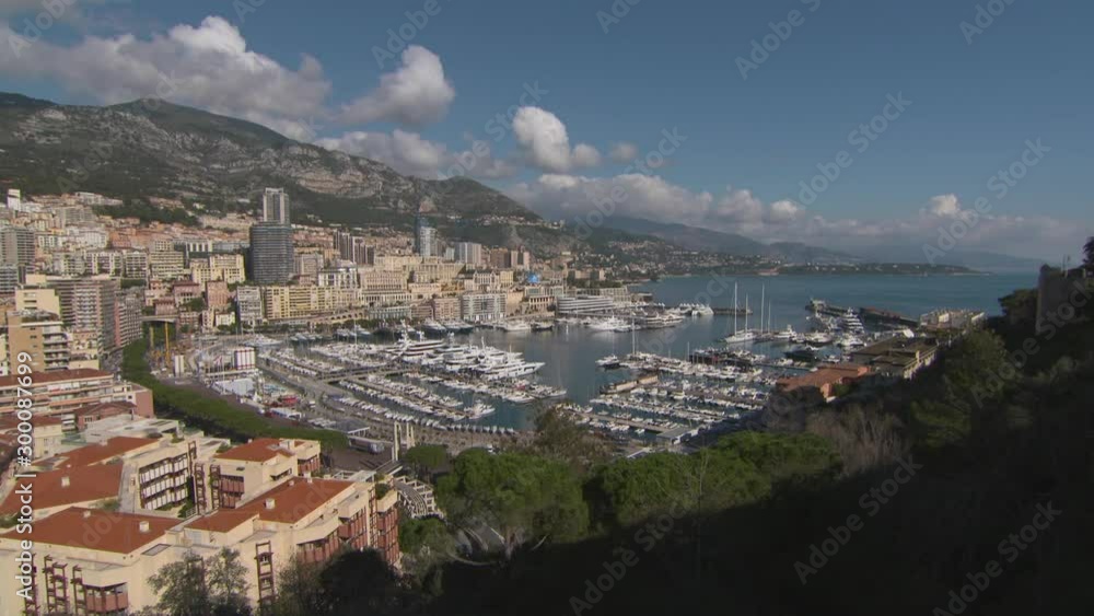 Aerial: Boats in Port Hercules amidst residential buildings at Monte Carlo against sky on sunny day Aerial: Boats in Port Hercules amidst residential buildings at Monte Carlo against sky on sunny day