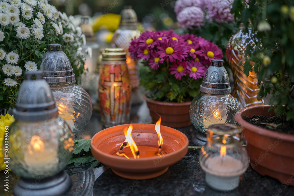 grave candle, cemetery lights on grave, flowers at the graveyard grave candle, cemetery lights on grave, flowers at the graveyard