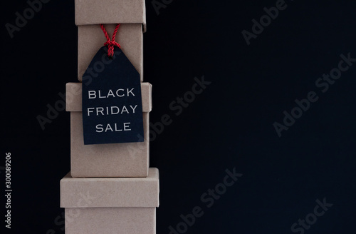 black friday sale tag on boxes dark background