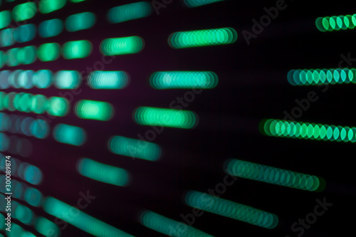 Abstract beautiful blurred or softy bokeh from LED lighting. Group of blurry brightness blue ornamental lights flickering in the park. Image for digital data transformation or Sci-Fi mystery concept.