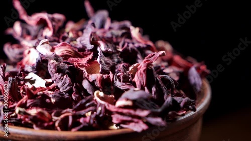 Large leaves of hibiscus red dry tea background, close up. Loop rotation.