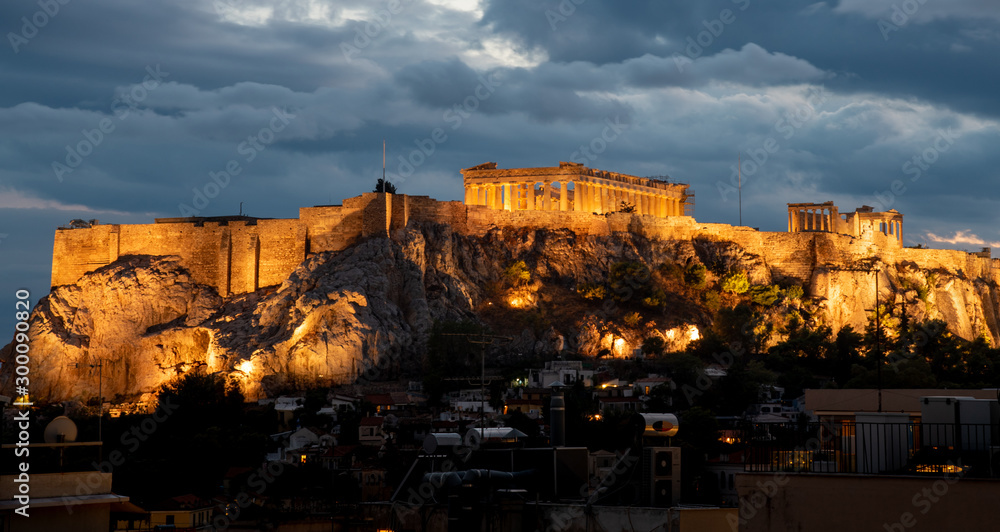 Athens Parthenon at Acropolis hill , during a cloudy sunset in Greece.