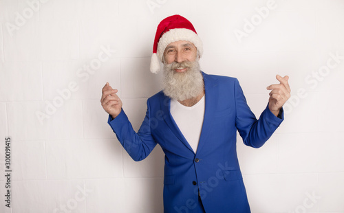 Holly jolly xmas, new year is soon! Be ready, prepare. Sales, discounts, presents, gifts selling time. Man wearing blue suit and red hat.