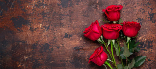Red rose flowers bouquet on wooden background Valentine's day greeting card Copy space Top view - Image